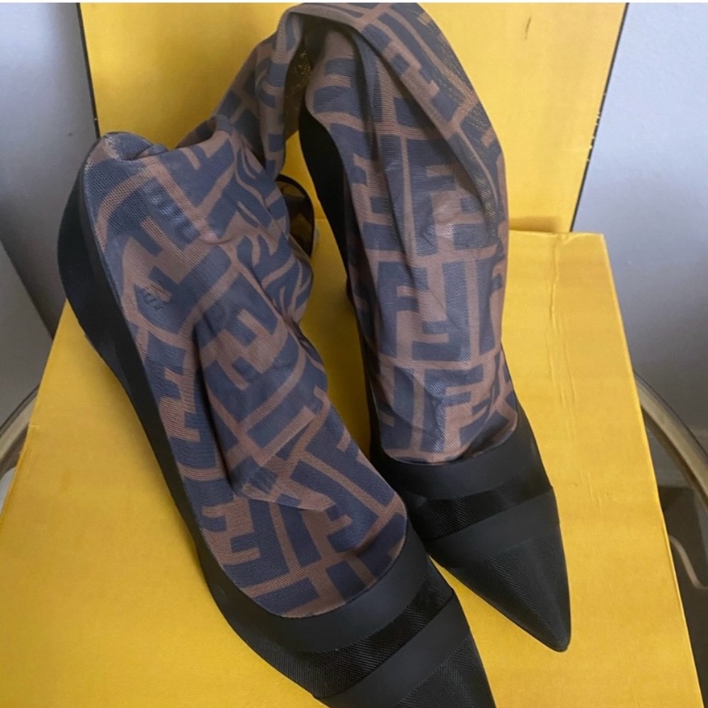 Fendi boots, very fancy, very demure. So comfortable. Worn 2xs… no damages